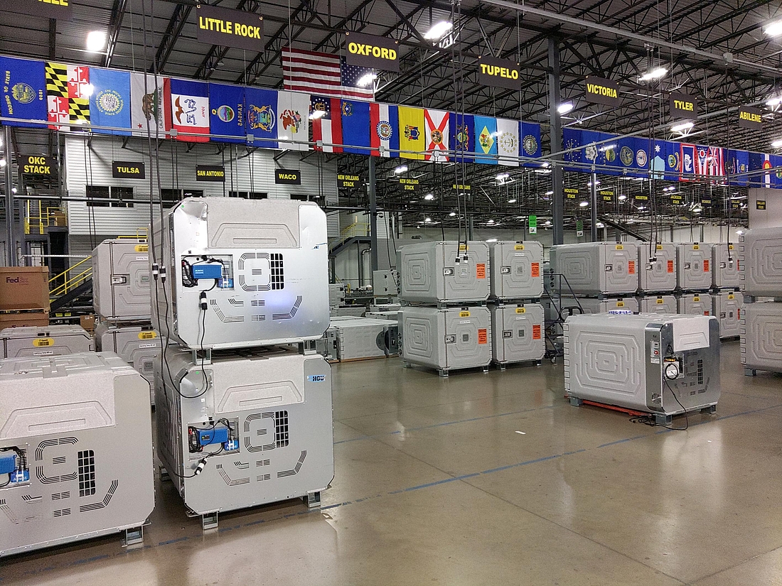 Coldtainer AuO in Morris & Dickson warehouse connected to the AC mains for battery recharge